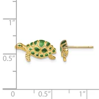 A pair of gold turtle stud earrings with green enamel shells, shown next to a measurement ruler indicating approximately half an inch in length.