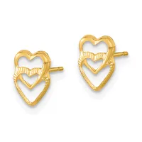 A pair of gold stud earrings featuring nested heart outlines with textured detailing on the upper heart, shown from the front.