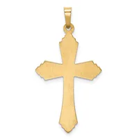 A gold cross pendant with a brushed finish and decorative notched edges at the ends of each arm, suspended from a gold bail.