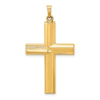 A polished gold cross pendant with vertical ribbed detailing on all four arms and a small loop at the top for hanging.