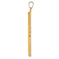 A long, narrow gold-colored metal pendant with a textured upper section and smooth shaft, suspended from a gold loop at the top.
