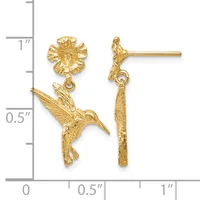 Gold hummingbird and flower dangle earrings displayed next to a ruler showing approximately one inch in length.