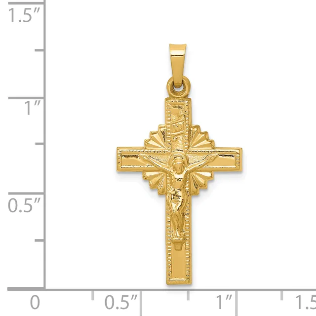 Gold-toned crucifix pendant with textured cross and sunburst halo behind the corpus, shown next to a ruler measuring approximately 1.25 inches tall.