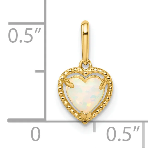 A gold heart-shaped pendant with a beaded border and opal stone center, shown next to a measurement scale indicating approximately 0.5 inches in height.