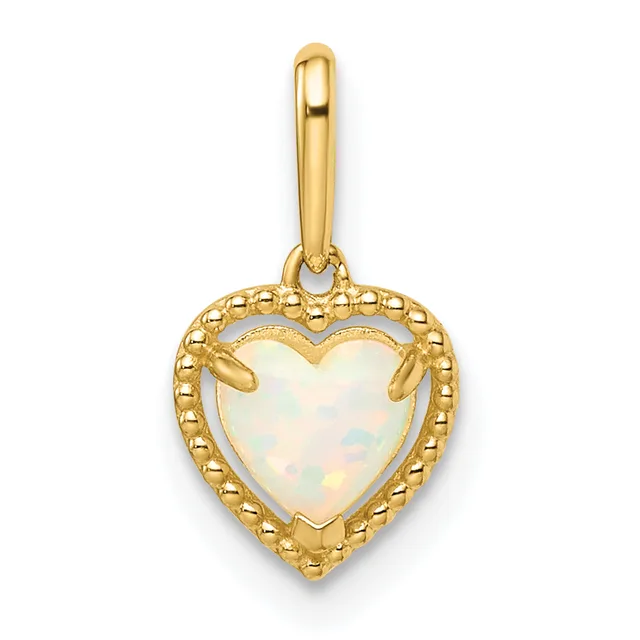Gold heart-shaped pendant with white opal center stone, beaded gold border, and hanging bail, shown against white background.