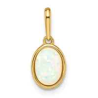 A gold oval pendant with a bezel-set white opal cabochon stone, suspended from a gold bail loop.