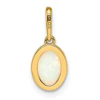 Gold oval pendant with a bezel-set white opal cabochon and a gold bail loop, displayed against a white background.