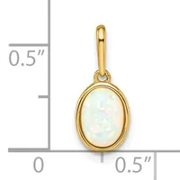 Gold oval pendant with a white opalescent stone in a bezel setting, shown next to a ruler indicating approximately 0.5 inches wide by 0.5 inches tall.