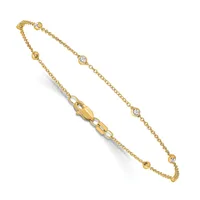 Gold chain bracelet with small round diamond accents spaced along the length, featuring a lobster clasp closure.