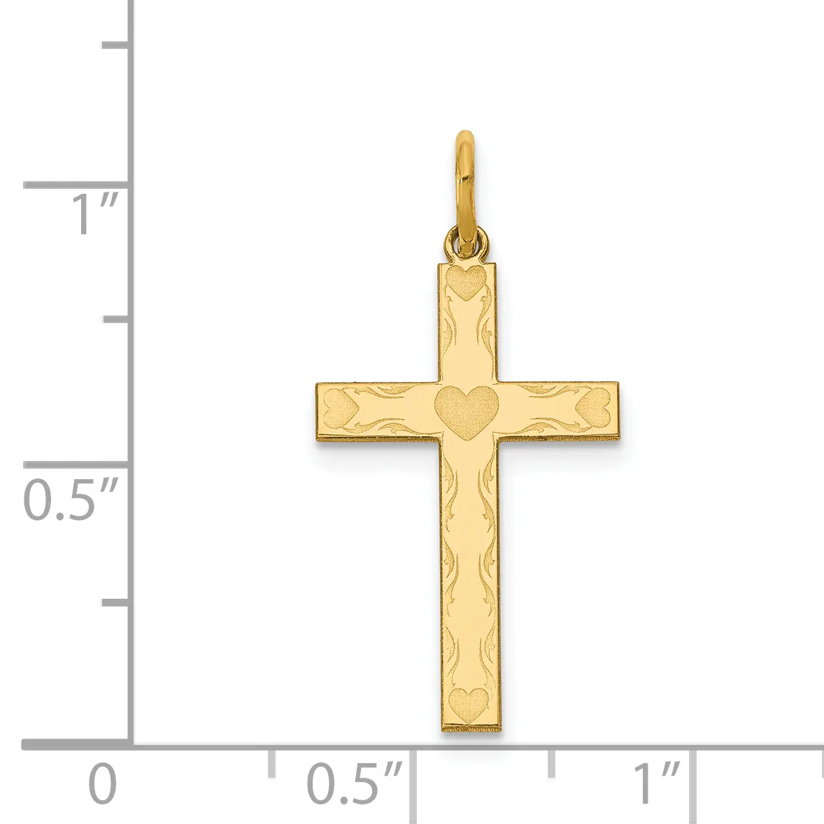 Gold cross pendant with heart motif at center and decorative scrollwork pattern, shown next to ruler indicating approximately one inch in height.