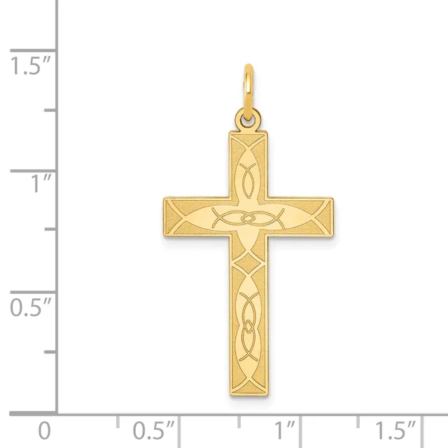 Gold cross pendant with interlocking Celtic knot designs displayed next to a measurement ruler showing approximately one inch width.
