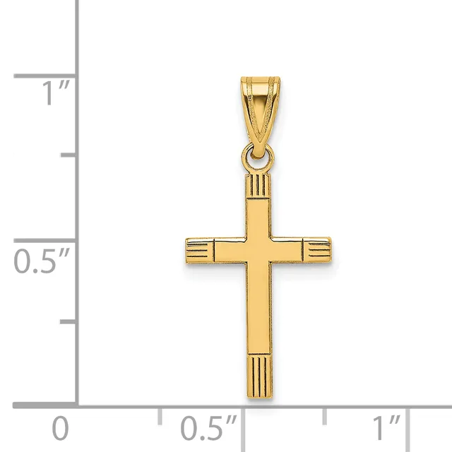 Gold cross pendant with textured details at the ends, shown next to a measurement scale indicating approximately one inch in height.