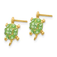 Pair of gold turtle stud earrings with green enamel shells decorated with green crystals and gold-plated legs and heads.