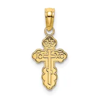 Gold cross pendant with ornate curved edges and religious inscriptions, suspended from a gold bail loop.