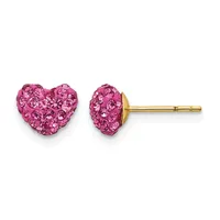 A pair of pink crystal heart-shaped stud earrings on gold posts, shown from the front and side view.