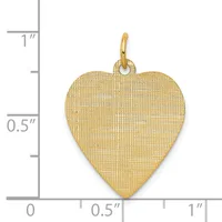 Gold heart pendant with textured surface and loop bail, shown next to ruler measuring approximately one inch tall and half inch wide.
