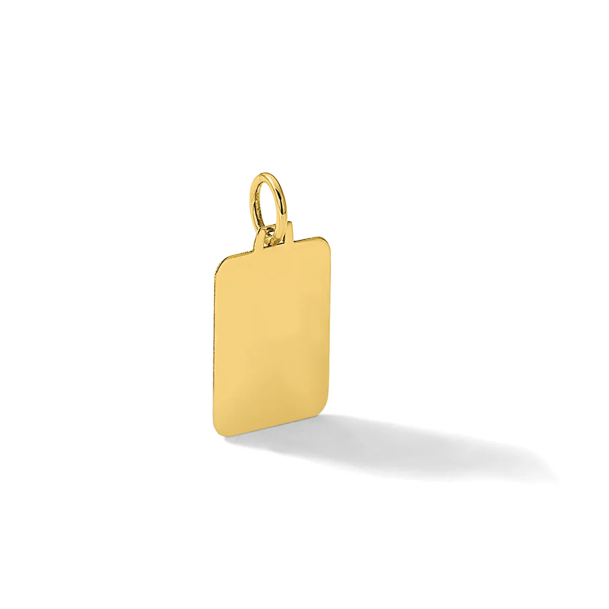 A polished gold rectangular pendant with rounded corners and a small loop attachment at the top, displayed at an angle with a subtle shadow beneath it.
