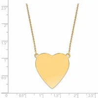 A gold heart pendant hangs from a delicate gold chain against a white background with a measurement scale on the left side.