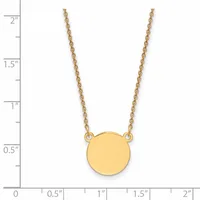 Gold chain necklace with a small circular gold pendant, shown against a ruler measuring approximately 2 inches in length.