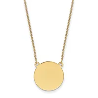 A gold chain necklace with a plain circular gold pendant suspended from two attachment points.