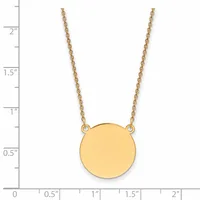 Gold-toned circular pendant necklace with chain, shown against a ruler displaying dimensions up to two inches.