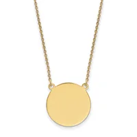 A gold chain necklace with a plain circular gold pendant hanging from two attachment points.
