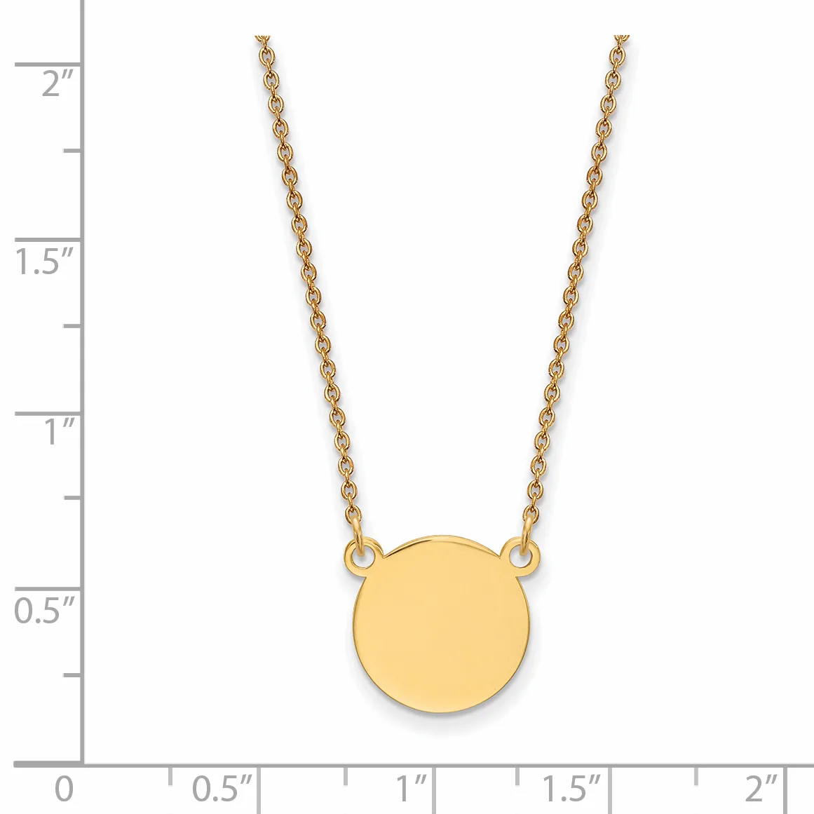 Gold-toned circular pendant on a delicate chain necklace, displayed against a measurement scale showing approximately two inches in length.