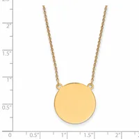 Gold necklace with a rope chain and a polished circular pendant, shown next to a ruler measuring approximately 2 inches in length.
