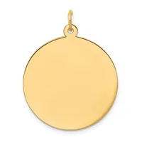 A polished gold circular pendant with a small loop attachment at the top.