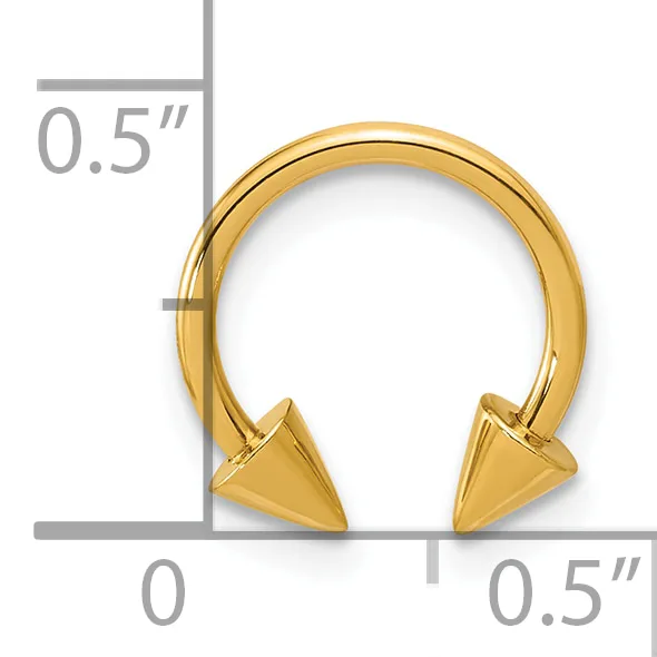 Gold-toned horseshoe-shaped bracelet with spiked cone ends, shown with measurement rulers indicating approximately 0.5 inches in height and width.