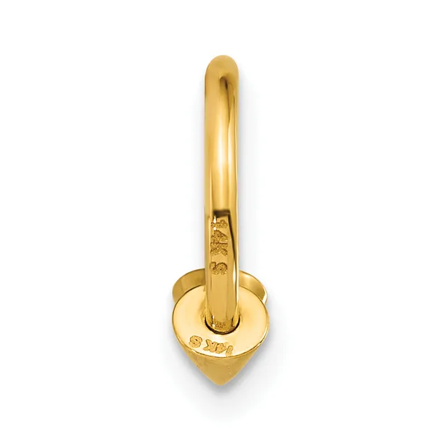 A gold hoop earring with a heart-shaped charm hanging from the bottom, shown against a white background.