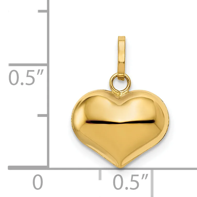 A polished gold heart-shaped pendant with a slot across the center, shown next to a measurement scale indicating approximately half an inch in height and width.