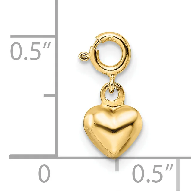A gold-toned heart charm with spring ring clasp, shown next to a ruler indicating approximately half an inch in width and height.