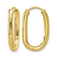 A pair of gold hoop earrings with textured and polished surfaces, shown from front and side angles.