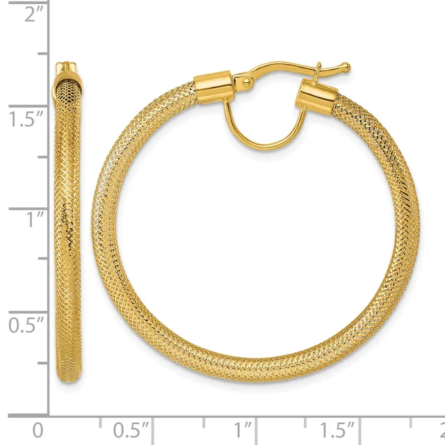Gold textured hoop earrings with a diameter of approximately 1.5 inches, shown with a measurement scale on the left side.