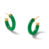A pair of polished green jade hoop earrings with gold-tone posts and backs, shown from two angles against a white background.