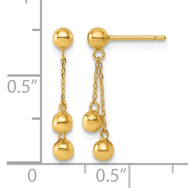 Pair of gold ball stud earrings with dangling chain and ball accents, shown against a measurement scale indicating approximately half an inch in length.