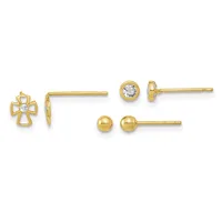 Three pairs of gold stud earrings displayed in a row: a cross with a center diamond, a bezel-set round diamond, and a polished gold ball.
