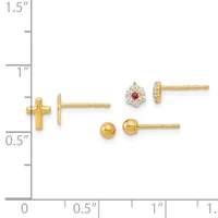 Three pairs of gold stud earrings displayed on a ruler showing measurements: small cross-shaped studs, round ball studs, and flower-shaped studs with a red center stone and clear stones.