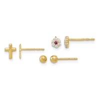 Three pairs of gold stud earrings displayed in a row: small cross posts, polished ball studs, and flower-shaped studs with purple and white stones.