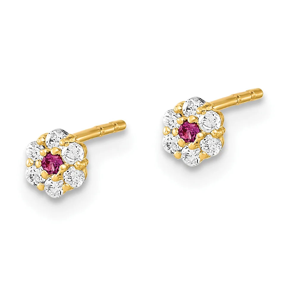 A pair of gold stud earrings featuring a cluster of round diamonds surrounding a central round purple gemstone, shown from the front against a white background.