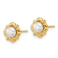 A pair of gold stud earrings featuring white pearl centers surrounded by decorative gold floral-shaped settings with posts and backs.