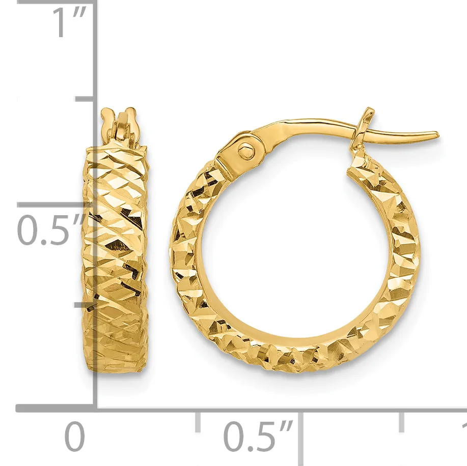 Pair of gold hoop earrings with textured diamond-cut surface and post backs, displayed next to a measurement scale showing approximately one inch in height.