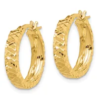 Pair of gold hoop earrings with a textured diamond-cut surface and polished grooved interior, shown from the front.