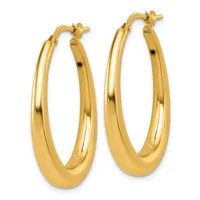A pair of polished gold oval hoop earrings with hinged posts and small black accents, displayed against a white background.