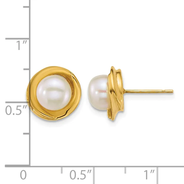 A pair of gold stud earrings with white pearl centers set in twisted gold bezels, displayed next to a ruler showing approximately half-inch diameter.