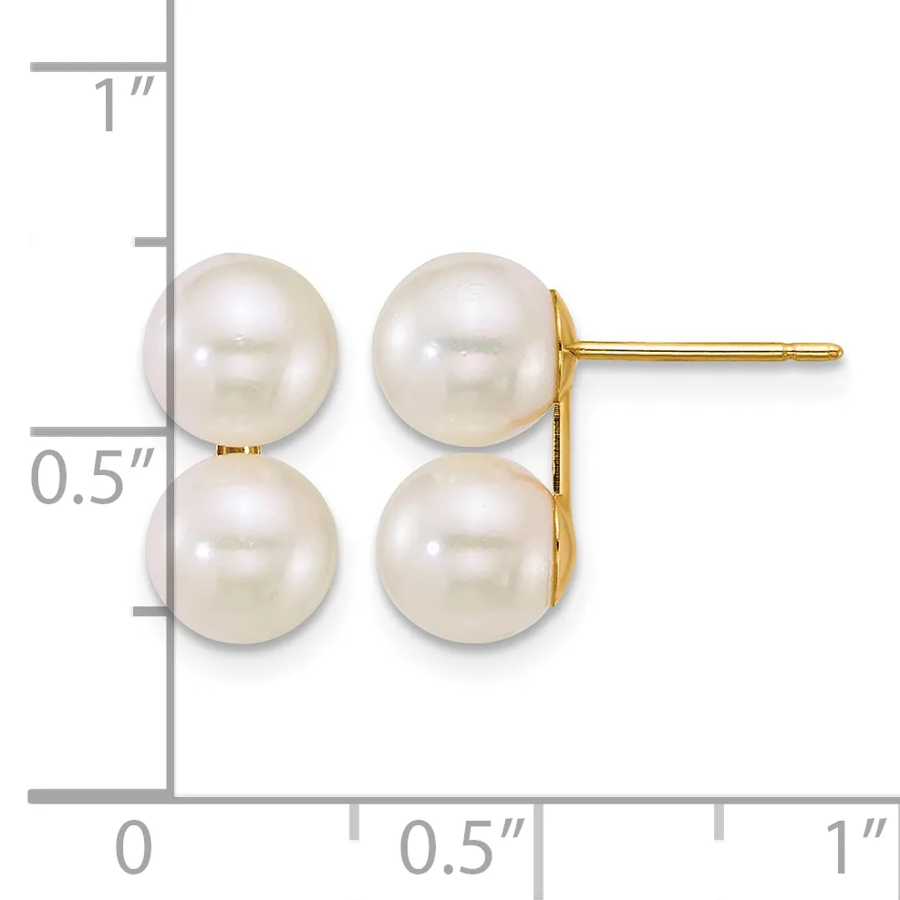 A pair of white pearl stud earrings with gold posts and backs, displayed against a ruler showing the earrings are approximately 0.5 inches tall.