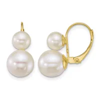 Pair of gold lever-back earrings with two white pearls of graduating sizes attached to each earring.