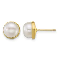 Pair of gold stud earrings with round white pearl tops set in polished yellow gold bezels, shown from front and side views.