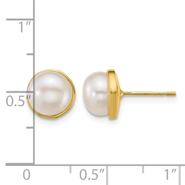 A pair of gold stud earrings with round white pearl tops, shown from front and side view against a measurement scale.